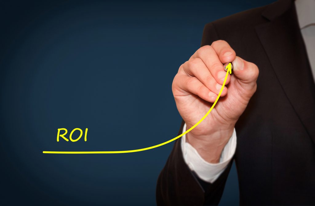 Businessman draw growing line symbolize growing ROI Return on Investment